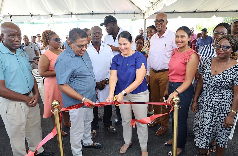 Minister Mustapha alongside Inter-American Development Bank Country Representative in Guyana, Lorena Solorzano-Salazar cutting the ribbon to commission the facility