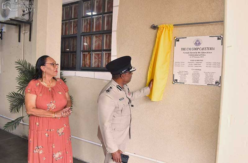 GPF Credit Union Manager, Ms. Donna Todd, looks on as Commissioner of Police, Clifton Hicken, officially opened the  ‘Uni Coop Cafeteria’ at its Credit Union Office on Camp Street, Eve Leary