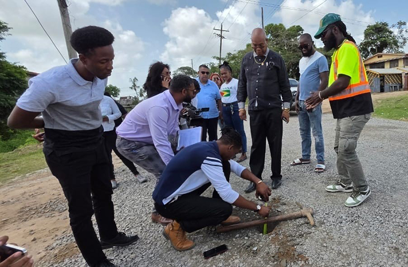 Minister of Public Works, Juan Edghill inspecting the quality of road works in New Amsterdam