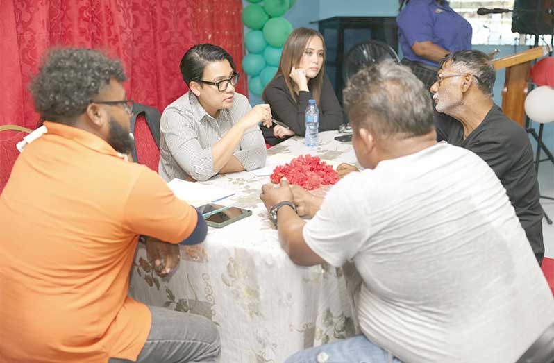 Minister Within the Ministry of Housing and Water, Susan Rodrigues, engages residents at Swan, Soesdyke/Linden Highway, on Monday