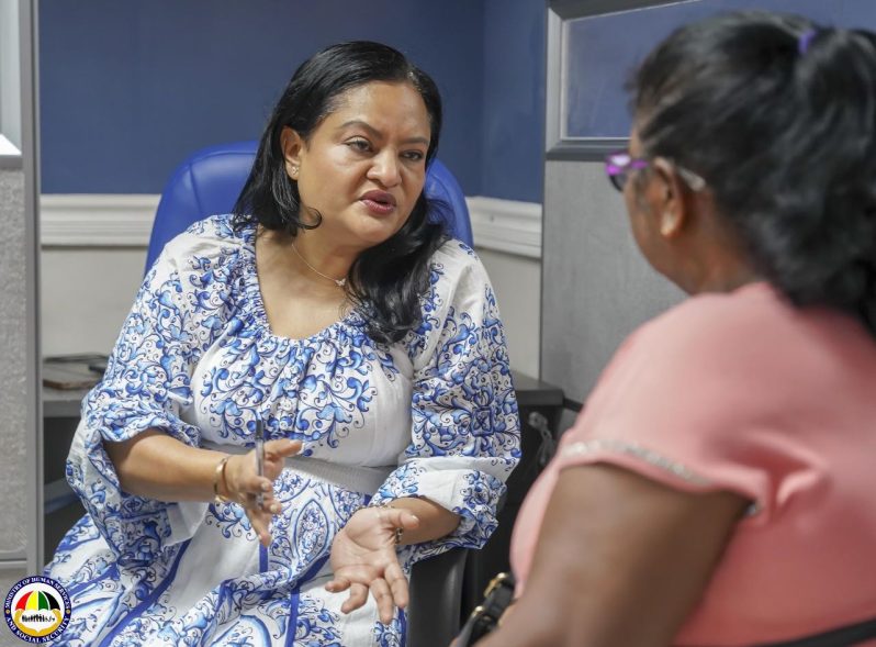 Minister of Human Services and Social Security, Dr. Vindhya Persaud, engages directly with a citizen
