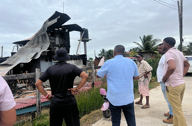 Regional Vice-Chairman, Zamal Hussain (second from left) meeting with Permaul Punsammi (left) on Thursday. Also pictured are the contractors who will be rebuilding Punsammi’s house