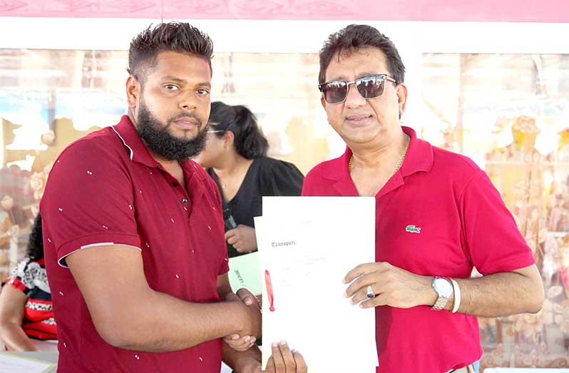 Excitement and gratitude filled the atmosphere in Walton Hall, Region Two, as 78 families finally received their official land transports
