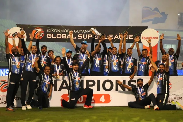 Champions of the ExxonMobil Guyana Global Super League T20, Rangpur Riders celebrate with the trophy after winning the ExxonMobil Guyana Global Super League T20 Final between Victoria and Rangpur Riders at Providence Stadium on December 06, 2024 in Georgetown, Guyana (Photo by Ashley Allen - GSLT20/Global Super League via Getty Images)