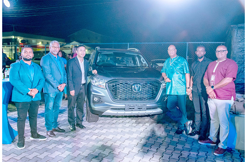 Minister of Public Works Bishop Juan Edghill near the Changan Hunter vehicle, with Managing Director of ANSA McAl, Troy Cadogan; Ansa Motors General Manager, Sudesh Mahase; Sales Manager, Yoganand Singh; and Commercial Counsellor at the Embassy of the People’s Republic of China, Li Hanquing, and Senior Director of Investment at the Guyana Office for Investment (GO-Invest), John Edghill (Delano Williams Photo)