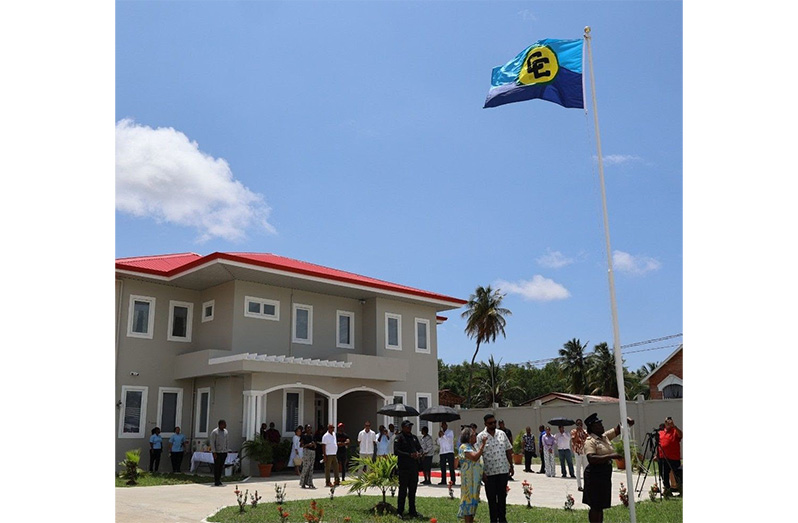 President, Dr Irfaan Ali hands over the new official residence of the CARICOM Secretary-General to the incumbent officeholder, Dr Carla Barnett, at a ceremony in Sparendaam, East Coast Demerara
