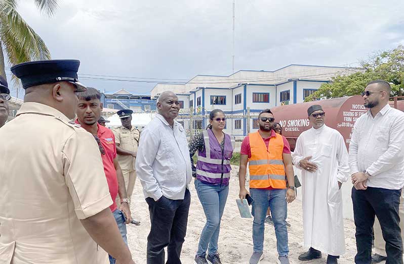 Minister of Home Affairs, Robeson Benn (centre), and Permanent Secretary Andre Ally engage with the contractor and engineers during a site visit to the Anna Regina Police Station project last Saturday.
