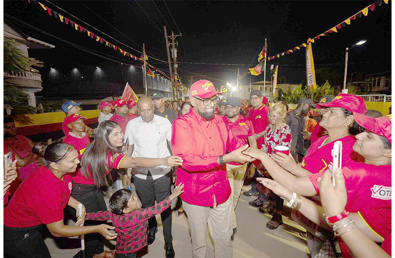 President, Dr. Irfaan Ali engages supporters at the PPP/C’s Bush Lot public meeting, on Friday evening (NCN photo)