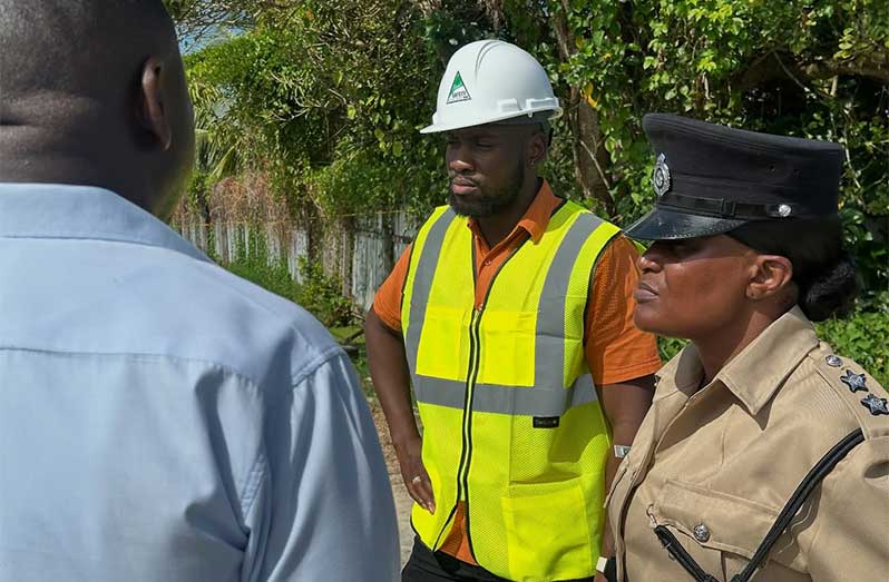 Minister of Labour and Manpower Planning Keoma Griffith is on the ground at a construction site in Bachelor’s Adventure along the Railway Embankment, where an accident occurred