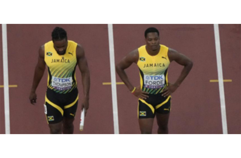 A disappointed Kishane Thompson (left) and Ryiem Forde, after their failed baton exchange on the final leg of the men’s 4×100 metres relay