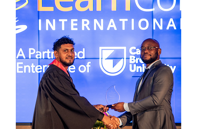 The trainee technicians with SBM Offshore Guyana's Human Resources Manager, Shaun Prince and President of LearnCorp International, Phil Doody