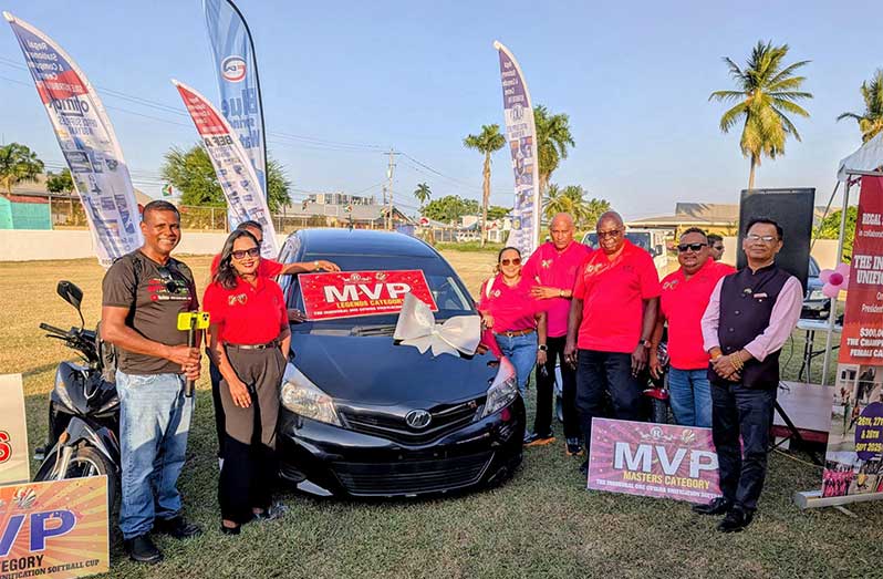 Officials of the GSCL and sponsors pose with the Toyota Vitz Car which will be won by the MVP of the Legends Over-50 category. From left are, Danny Persaud of ARD Youtuber, Tilesha Ousman, Secretary/Treasurer of the GSCL, Shurine Hardyal/Mahendra Hardyal of title sponsors, Regal Stationery & Computer Centre, GSCL President Ian John, Tournament Director John Ramsingh and Jitendra Singh of Rajiv Gandhi University