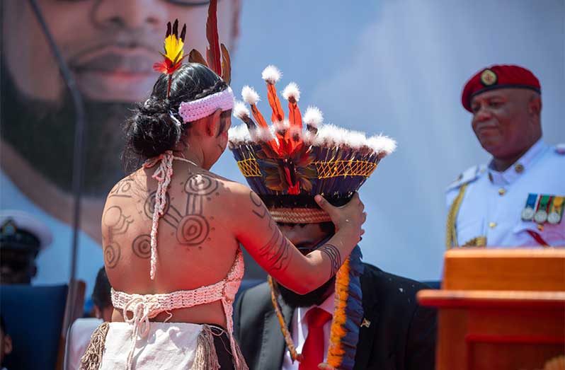 A Cacique's Crown or what is commonly known as an Amerindian headdress is placed on President Ali’s head moments after he took the oath of office to officially mark the beginning of his second term as Guyana’s Head of State (Delano Williams photos)