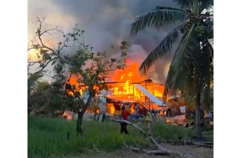 Clinton George’s building at Charity, on fire