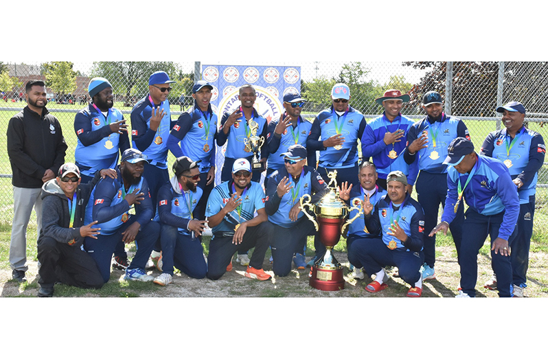 The victorious Mercenary players pose with their winnings. OSCL President Shiv
Persaud is at extreme right