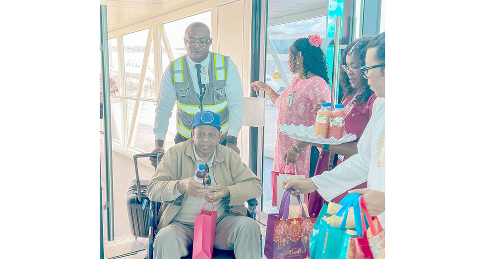 Passengers as they arrived in Guyana via CJIA being welcomed for Diwali celebrations with sweet treats and local fruit juices (Japheth Savory photos)