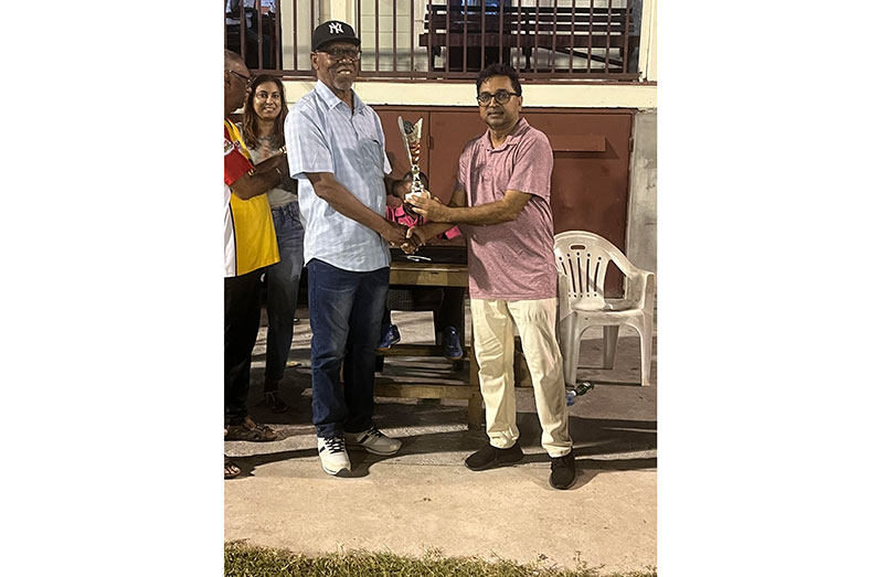 Man-of-the-match in the winning team, Lalta Gainda, receives his award from Frederick Halley