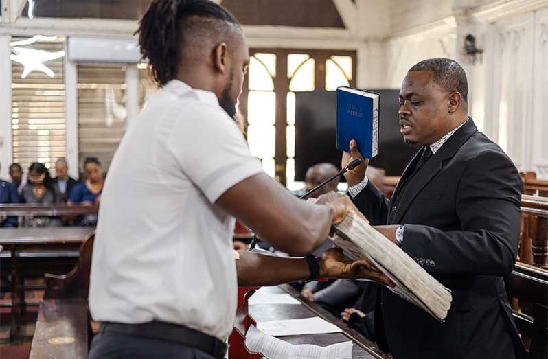 Attorney-at-Law Michael Hutson taking the oath