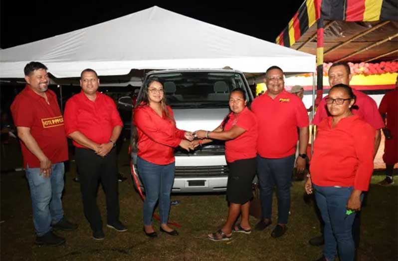 Minister of Amerindian Affairs Sarah Browne-Shadeek hands over a new bus to the village