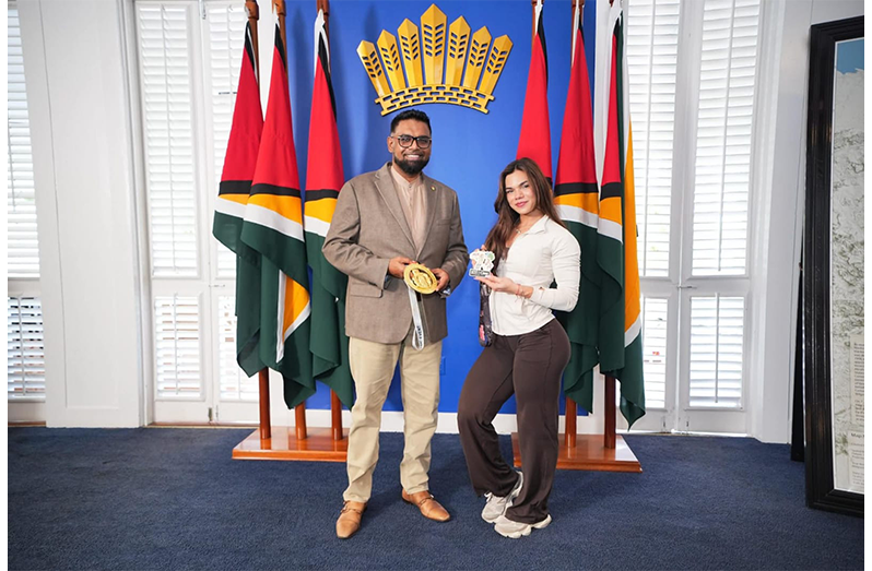 H.E. Dr. Mohamed Irfaan Ali (left) stands with Rosanna Fung
