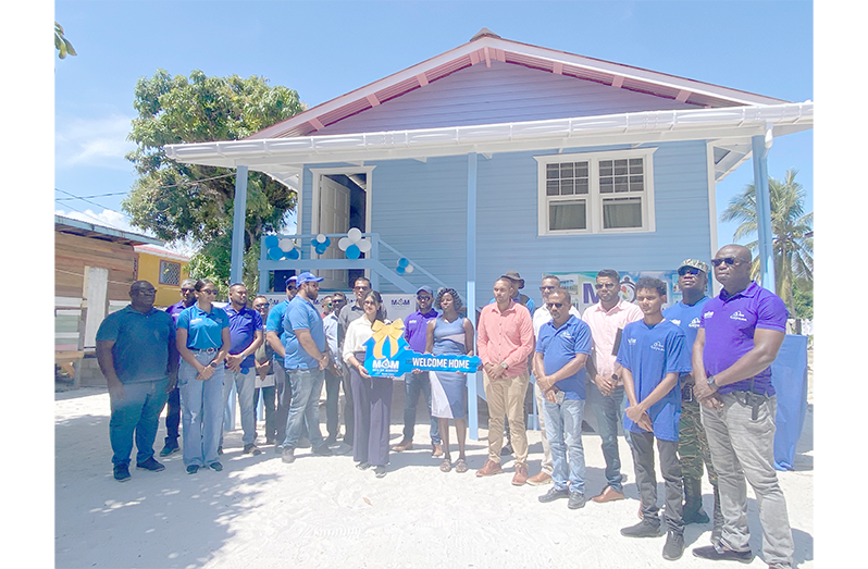 IN Men on Mission handing over the first house to Yonette Sargeant of Pomona