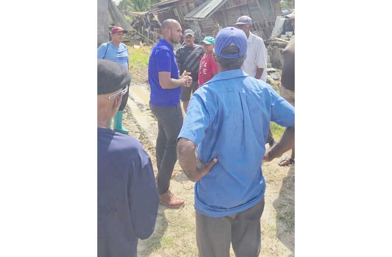 Regional Chairman, Devin Mohan, speaks with affected residents in Lima Housing Scheme