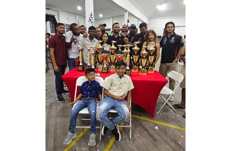 Shan Seejatan (Centre) with his team and trophies