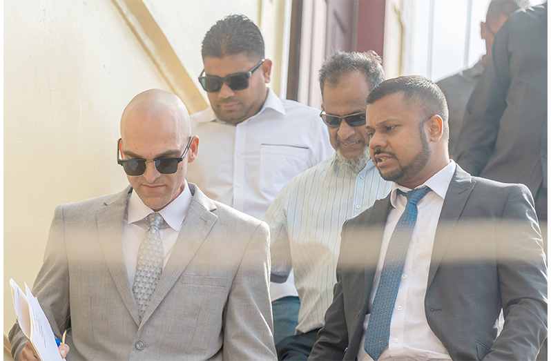 Nazar and Azruddin Mohamed pictured with their attorneys, Siand Dhurjon and Damien Da Silva (Delano Williams photo)