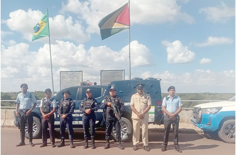 Officers at the Takutu International Bridge between Brazil and Guyana