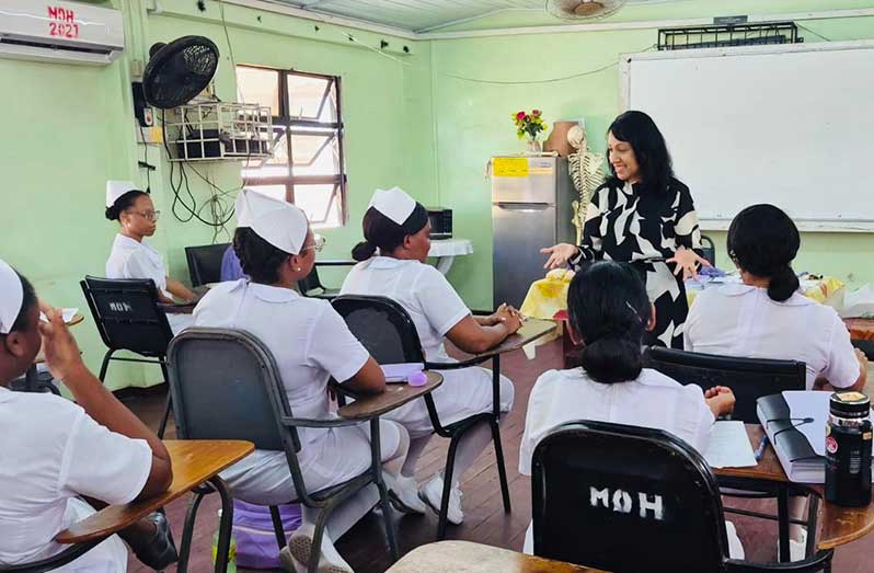 Dr Misir interacting with nurses last week during her visit to the Georgetown School of Nursing
