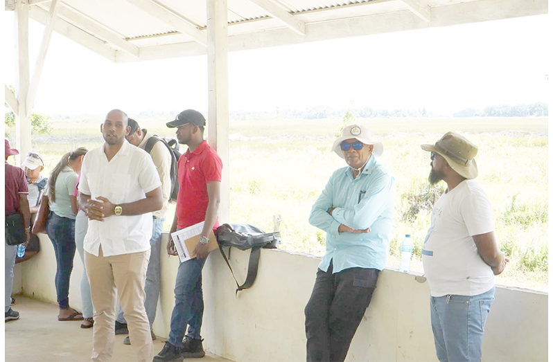 Minister within the Ministry of Public Works Madanlall Ramraj and other officials engaging Wakapoa residents on Friday