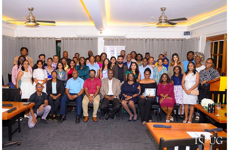 Professor Temitope Oyedotun, Guyana-PROMAR Project Lead and lecturer at the University of Guyana’s Faculty of Earth and Environmental Sciences; Mr. Amarnath Munnolimath, Head of Green and Circular Economy at Adelphi; and Ms. Tracy Phillips of the United Nations Environment Programme (UNEP) Cartagena Convention Secretariat, pose with awardees and attendees at the PROMAR closing ceremony at the Grand Coastal Inn Hotel, East Coast Demerara, on October 14, 2026, marking the conclusion of the project’s implementation phase in Guyana