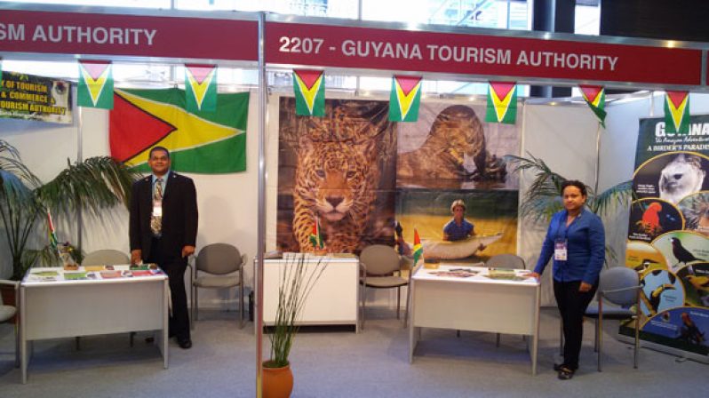 GTA Director, Mr. Indranauth Haralsingh, and Communications Manager, Ms. Chevon Lim at the Guyana booth at the trade fair