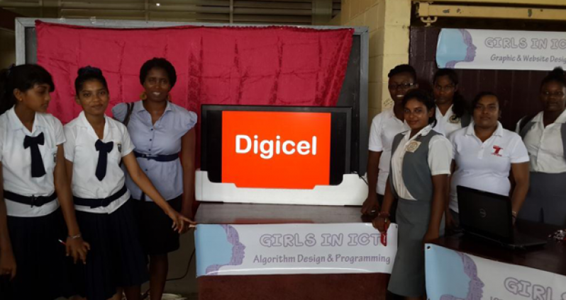 Middle row right: Mrs. Adellie Lee (IT Application Analyst) and Ms. Deepa Rohit (Quality Assurance Trainer) with some students and teachers at the Tech Day camp in Berbice.