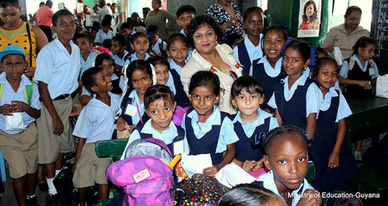 Minister Manickchand poses with students of the Cotton Tree Primary
(Photos compliments of Education Ministry)