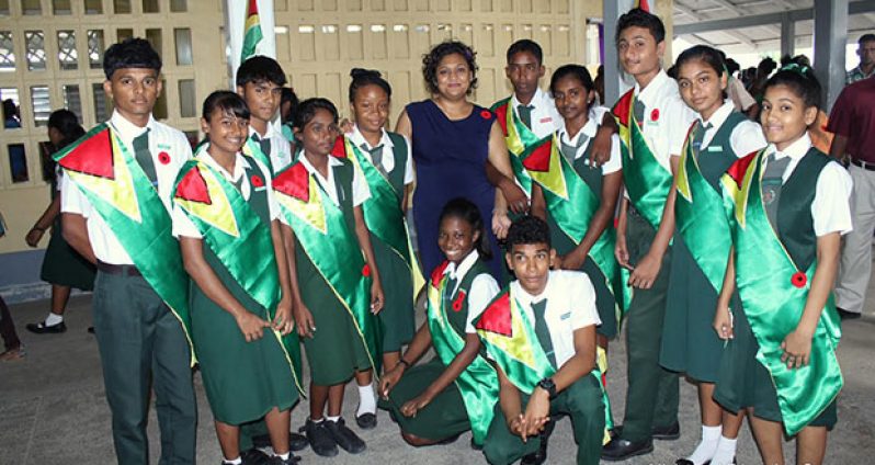 A West Demerara Secondary School student poses with Minister Priya Manickchand