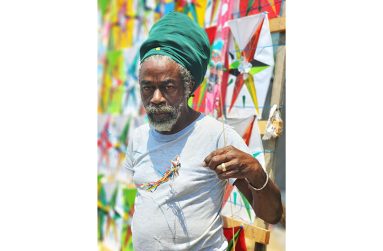 Maurice Prince with one of his signature miniature kite creations (Samuel Maughn photos)