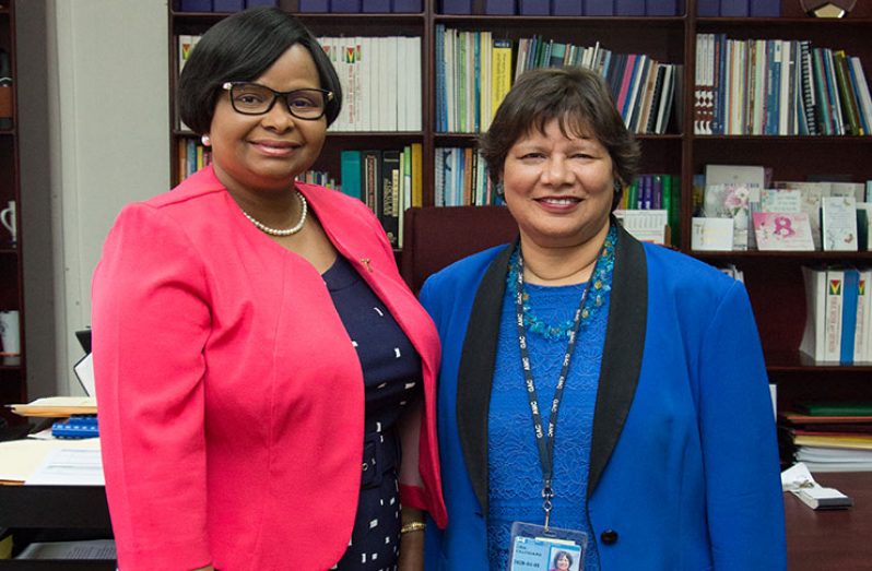Public Health Minister, Volda Lawrence (left) shares a light moment with Canadian High Commissioner to Guyana, Lilian Chatterjee