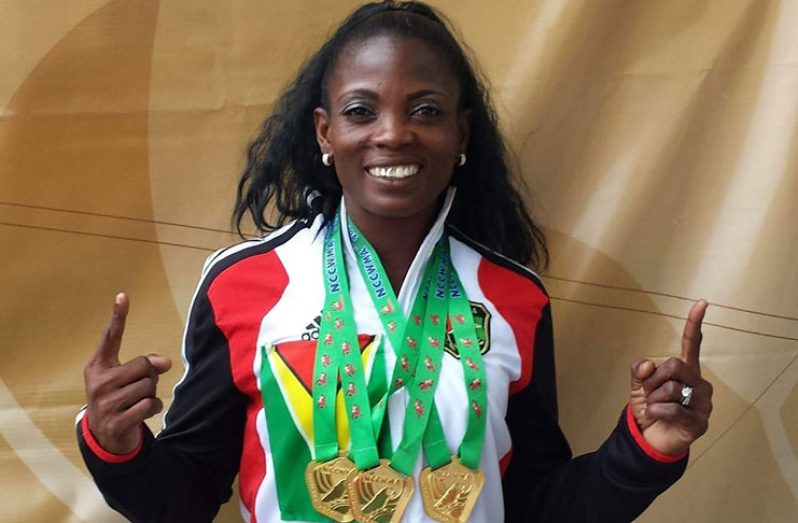 Ms. Alisha Fortune displaying some of her gold medals