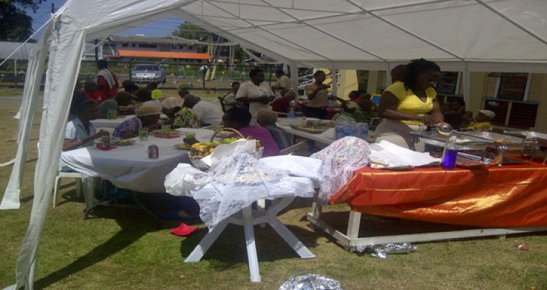 Senior citizens partaking in the brunch in the Palms compound