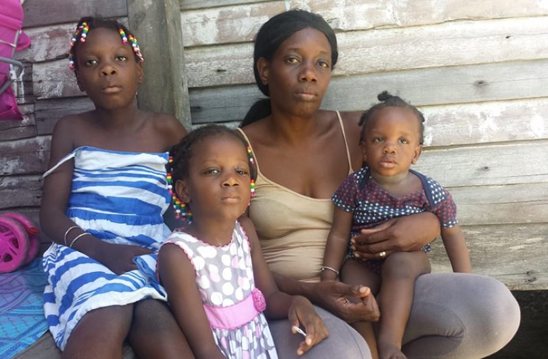 Stacey Skeete (with 10- month-old baby in hand), along with four of her other children at their Plaisance home.