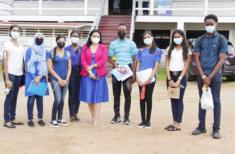 Minister of Human Services and Social Security, Dr. Vindhya Persaud, with some of the young influencers.