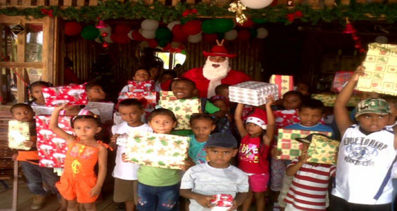The children join Santa for a photo ‘op’