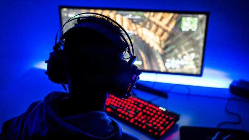 Young adults can spend hours and hours playing computer games (Getty Images) (Retrieved from BBC, October 26, 2021)