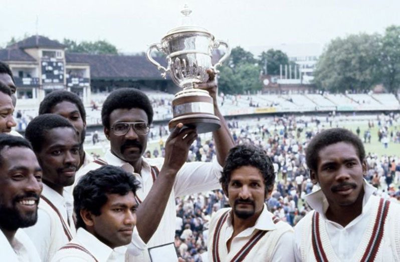 TWO in a row: Sir Clive Lloyd and his players with  the1979 trophy.