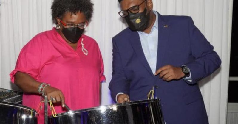Prime Minister Mottley tries her hand at the Steel Pan as President Ali coaches (Office of the President photo).