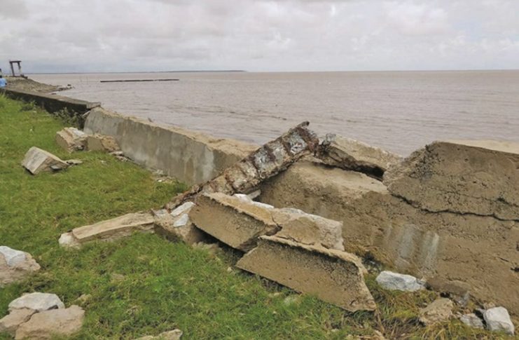 Damage caused to seawall by waves due to overtopping