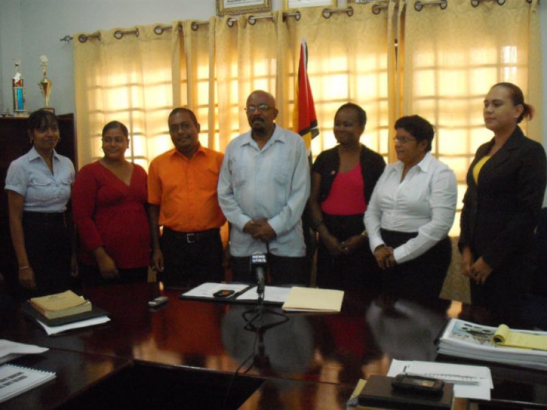 Minister Whittaker, at centre, with officers of the six municipalities