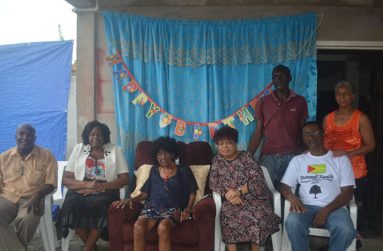 Seated: L-R: Mr. Rudolph Adams, Chairman of the Mocha Arcadia NDC, Ms. Genevieve Allen, Regional Chairman, Region Four; Aunty Ina; Minister Amna Ally, and Lance Bacchus, the centenarian’s eldest living child. Her other two surviving children stand at the back