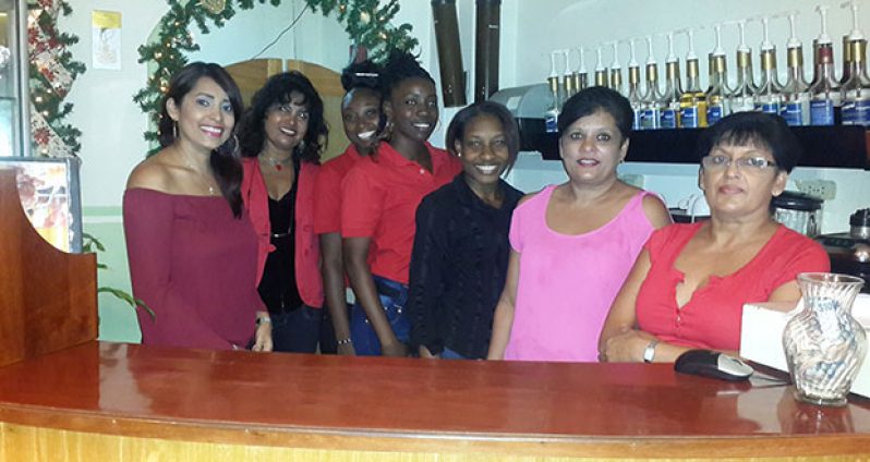 Narvini Dewnath (left), founder and owner of the Coffee Bean Café & Eatery, happily poses with her staff as they commemorate their 4th Anniversary